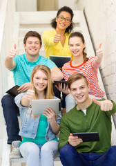 smiling students with tablet pc computer