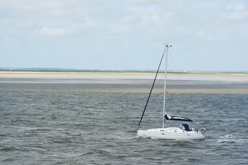 Sail yacht at Dutch wadden sea