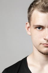 Obraz premium closeup portrait of young man isolated on light background