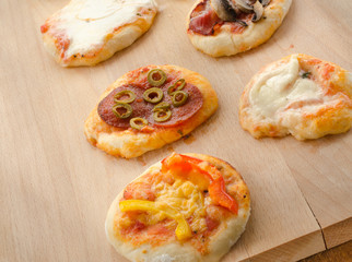 Italian pizza with paprika, salami and olives