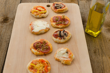 Italian pizza with paprika, salami and olives