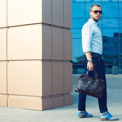 Metrosexual man in trendy casual clothing near shopping mall