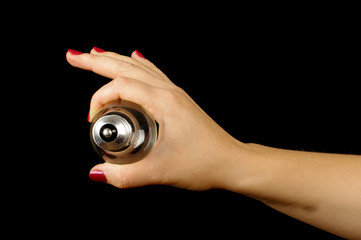 Woman hand showing plinth of the lamp