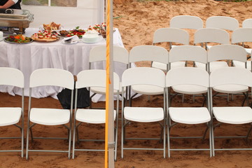 seats for guests - white chairs outside near the buffet table