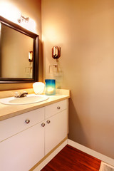 Fototapeta na wymiar Bathroom vanity with candle on it