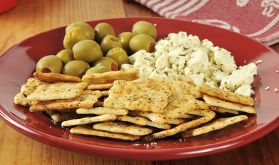 Feta cheese with crackers and olives