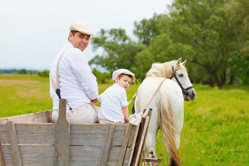 funny photo of farmer family and horse looking back