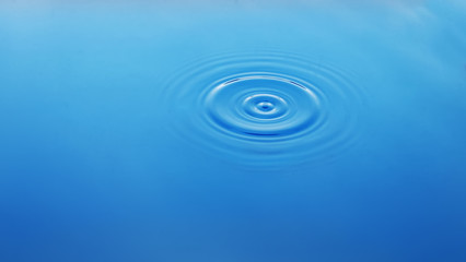 Wavy circles on the water, blue background