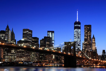Fototapeta na wymiar Brooklyn Bridge and Manhattan Skyline At Night, New York City
