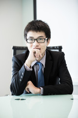 Image of young handsome confident businessman in suit