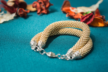 Bracelet of gold color from beads