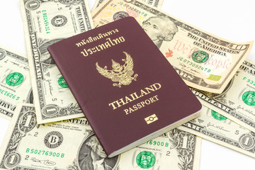 Thailand passport on U.S. Currency bank note.