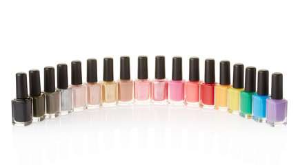 Nail polish bottles colorful group on white, clipping path
