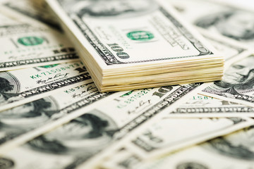 Stack of one hundred dollar bills close-up. (shallow DOF)