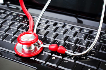 Stethoscope on computer keyboard.