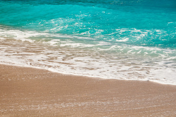 Seashore, waves and sandy beach