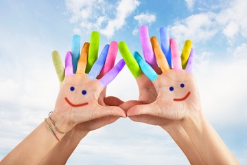 Painted hands with smile