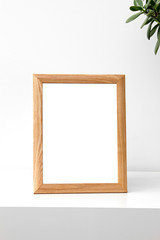 blank photo frame on table in the room