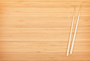 Sushi chopsticks on bamboo table