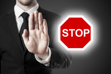businessman holding hand block stop sign