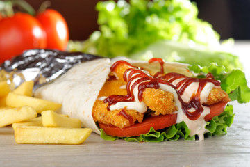 Tortilla with Chicken nuggets, french fries and vegetables