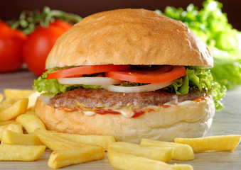 Big juicy gourmet burger with chips