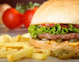 Big juicy Mexican burger with spicy jalapenos, nacho cheese