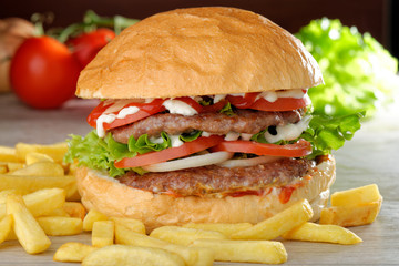 Big juicy double burger with french fries