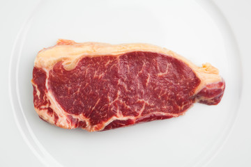fresh marbled meat on a plate