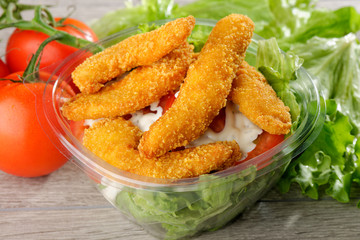 Close up of take away bowl with fast food  chicken salad