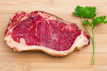 Fototapeta premium fresh marbled meat on a wooden hardboard