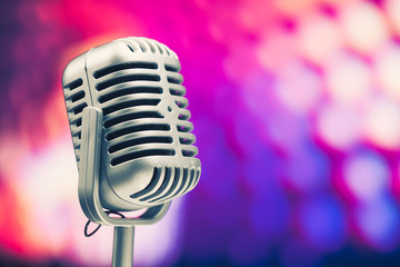 Fototapeta na wymiar retro microphone on purple background