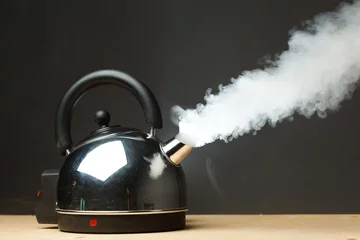 Foto op Aluminium boiling kettle © nikkytok