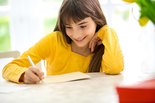 Cute Girl Writing A Letter