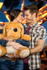 Fototapeta na wymiar Romantic couple at amusement park