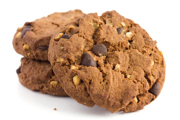 Chocolate chip and nut biscuits with crumbs on white