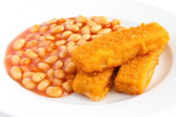 Plate of baked beans with fried fishfingers
