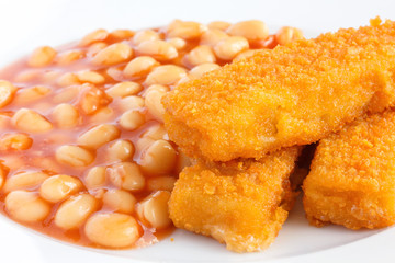 Plate of baked beans with fried fishfingers