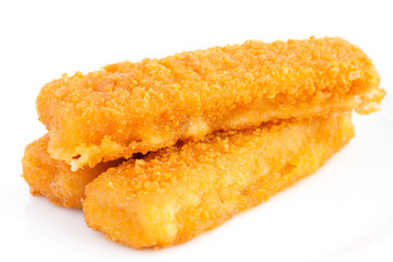Fried fishfingers on white surface