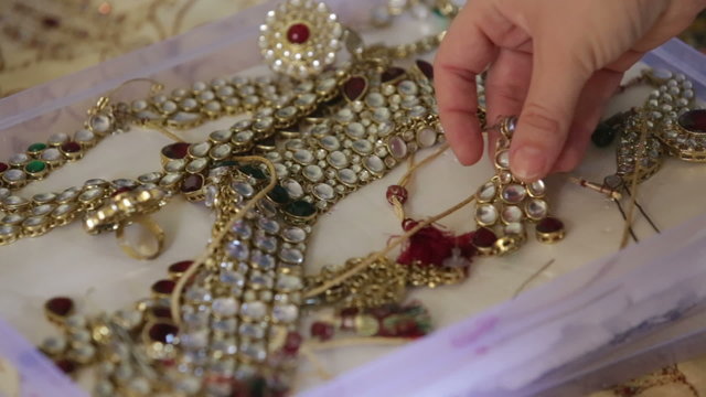 iindian hand show jewelry in box