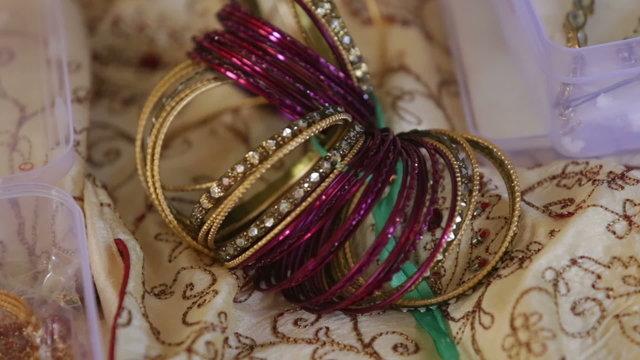 indian ring bracelet on textile near box