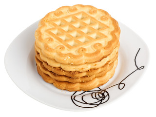 Stack of cookies on a white plate