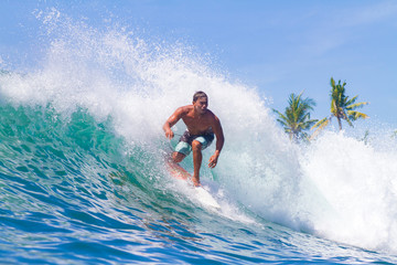Surfing a Wave. Bali Island. Indonesia.