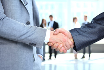 Business people shaking hands, finishing up a meeting 