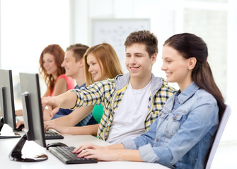 female student with classmates in computer class