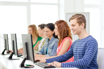 Fototapeta premium male student with classmates in computer class