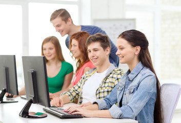 female student with classmates in computer class