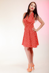 Full length pinup girl woman in retro red dress. Vintage.