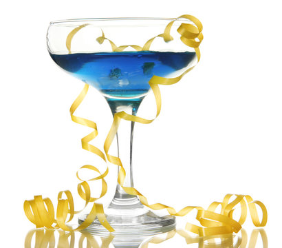 Glass of cocktail and streamer after party isolated on white