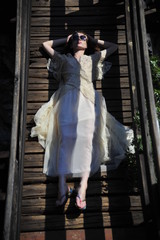 Girl lying on a bridge